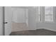 An open doorway reveals a carpeted bedroom with white trim and window shutters at 10113 Plomosa Pl, Las Vegas, NV 89134