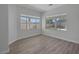 Bright bedroom with dual windows offering a view of the backyard at 10113 Plomosa Pl, Las Vegas, NV 89134