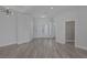 Spacious entry foyer boasts wood-look floors and designer lighting and opens to the living areas at 10113 Plomosa Pl, Las Vegas, NV 89134