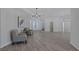 Inviting foyer with tile floors, stylish lighting, seating area, and decorative front doors at 10113 Plomosa Pl, Las Vegas, NV 89134
