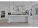 Spacious kitchen featuring a large island with seating and modern stainless steel appliances at 10113 Plomosa Pl, Las Vegas, NV 89134
