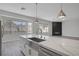 Spacious kitchen with an island, stainless steel appliances, and large windows offering great views at 10113 Plomosa Pl, Las Vegas, NV 89134