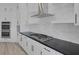 Modern kitchen featuring stainless steel appliances, black countertops, and white cabinets at 10113 Plomosa Pl, Las Vegas, NV 89134