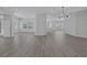 Open concept living area with wood-look flooring, recessed lighting, and ample natural light at 10113 Plomosa Pl, Las Vegas, NV 89134