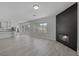 Open-concept floor plan with fireplace connecting living room to the kitchen at 10113 Plomosa Pl, Las Vegas, NV 89134