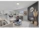 Stylishly decorated living room with fireplace and open concept kitchen and dining at 10113 Plomosa Pl, Las Vegas, NV 89134