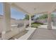 Covered patio with a built in grill and view of artificial grass at 10113 Plomosa Pl, Las Vegas, NV 89134