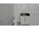 Elegant powder room featuring a modern vanity and stylish wallpaper at 10113 Plomosa Pl, Las Vegas, NV 89134