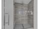 Modern bathroom shower featuring glass doors and sleek fixtures at 10113 Plomosa Pl, Las Vegas, NV 89134