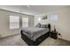 Bedroom with a queen bed and two windows at 1131 Ruby Sparrow St, Henderson, NV 89011