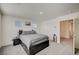 Comfortable carpeted bedroom featuring a queen bed and windows providing natural light at 1131 Ruby Sparrow St, Henderson, NV 89011