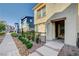 Street view of a modern home with a well-maintained front yard and sidewalk at 1131 Ruby Sparrow St, Henderson, NV 89011