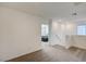 Upstairs hallway with carpet flooring leading to a bedroom at 1131 Ruby Sparrow St, Henderson, NV 89011