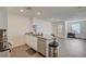 Open-concept kitchen with stainless steel appliances and gray-toned countertops at 1131 Ruby Sparrow St, Henderson, NV 89011