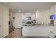 Modern kitchen featuring granite countertops, stainless steel appliances and white cabinets at 1131 Ruby Sparrow St, Henderson, NV 89011
