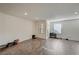 Open living room with recessed lighting and sleek gray wood-look laminate flooring at 1131 Ruby Sparrow St, Henderson, NV 89011