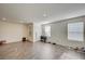 Spacious living room with modern laminate flooring and an abundance of natural light at 1131 Ruby Sparrow St, Henderson, NV 89011