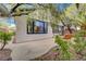 Backyard featuring a concrete patio, desert landscaping and a stucco wall at 11441 Drappo Ave, Las Vegas, NV 89138