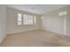 Spacious bedroom with neutral walls, plush carpeting and many windows for lots of natural light at 11441 Drappo Ave, Las Vegas, NV 89138