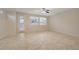 Bright bedroom with tiled floors, ample natural light, and a ceiling fan at 11441 Drappo Ave, Las Vegas, NV 89138