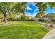 Beautiful community park with lush green lawns, mature trees, and scenic walking paths for residents to enjoy at 11441 Drappo Ave, Las Vegas, NV 89138