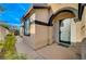 Inviting front entryway with stylish door and well-kept landscaping at 11441 Drappo Ave, Las Vegas, NV 89138