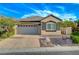 Charming single-story home featuring a well-manicured front yard and a two-car garage at 11441 Drappo Ave, Las Vegas, NV 89138