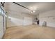 Spacious two-car garage with ample storage cabinets, bright lighting, and epoxy-coated floors at 11441 Drappo Ave, Las Vegas, NV 89138