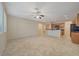 Bright open kitchen boasts stainless appliances, a breakfast bar, and neutral countertops at 11441 Drappo Ave, Las Vegas, NV 89138