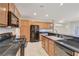 Gourmet kitchen featuring stainless steel appliances, breakfast bar, and gas range at 11441 Drappo Ave, Las Vegas, NV 89138