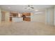 Open concept kitchen with stainless steel appliances, a breakfast bar, and ample cabinet space at 11441 Drappo Ave, Las Vegas, NV 89138