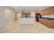 Bright kitchen features stainless appliances, a breakfast bar, and easy access to other living spaces at 11441 Drappo Ave, Las Vegas, NV 89138