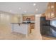 Modern kitchen features stainless steel appliances, a breakfast bar, and lots of light at 11441 Drappo Ave, Las Vegas, NV 89138