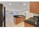Open kitchen features stainless appliances, a breakfast bar, and seamless flow to the living spaces at 11441 Drappo Ave, Las Vegas, NV 89138