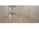 Open living space with tile flooring, neutral walls, and ample natural light at 11441 Drappo Ave, Las Vegas, NV 89138