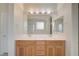 Bright bathroom with double sink vanity and a large mirror, perfect for getting ready at 11441 Drappo Ave, Las Vegas, NV 89138