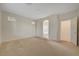 Spacious main bedroom featuring neutral walls and carpet, plus an open doorway to the main bathroom at 11441 Drappo Ave, Las Vegas, NV 89138