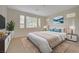 Inviting bedroom with a plush bed, soft lighting, and a serene atmosphere with bright, airy windows at 11441 Drappo Ave, Las Vegas, NV 89138