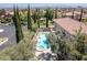 Aerial view showcasing a home with a pool, spa, and well-maintained landscaping at 11550 Lampeter Ct, Las Vegas, NV 89138