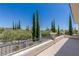 Balcony view showcasing a serene neighborhood with lush trees and well-maintained landscaping at 11550 Lampeter Ct, Las Vegas, NV 89138