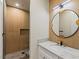 Stylish bathroom featuring a modern vanity, wood-look shower, and sleek fixtures at 11550 Lampeter Ct, Las Vegas, NV 89138