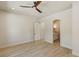 Bedroom showing wood flooring, ample natural light, and ensuite bathroom access at 11550 Lampeter Ct, Las Vegas, NV 89138