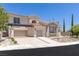 Beautiful two-story home with a well-manicured yard and three-car garage at 11550 Lampeter Ct, Las Vegas, NV 89138