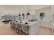 Bright and open kitchen with a large center island, modern fixtures, and seating for casual dining at 11550 Lampeter Ct, Las Vegas, NV 89138
