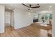 Spacious living area featuring hardwood floors, recessed lighting, and an easy transition to an adjacent sitting room at 11550 Lampeter Ct, Las Vegas, NV 89138
