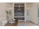 Office area highlighting custom shelving with stylish decor, and modern lighting at 11550 Lampeter Ct, Las Vegas, NV 89138