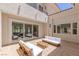 Outdoor patio featuring a seating area with sliding glass door at 11550 Lampeter Ct, Las Vegas, NV 89138