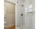 Modern glass shower featuring decorative tiling, a glass door, and a built-in niche at 11550 Lampeter Ct, Las Vegas, NV 89138