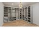 Large walk-in closet featuring custom shelving, drawers, and ample storage space at 11550 Lampeter Ct, Las Vegas, NV 89138