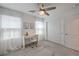 A bedroom with natural light, a ceiling fan and a closet with barn doors at 12286 Silvana St, Las Vegas, NV 89141